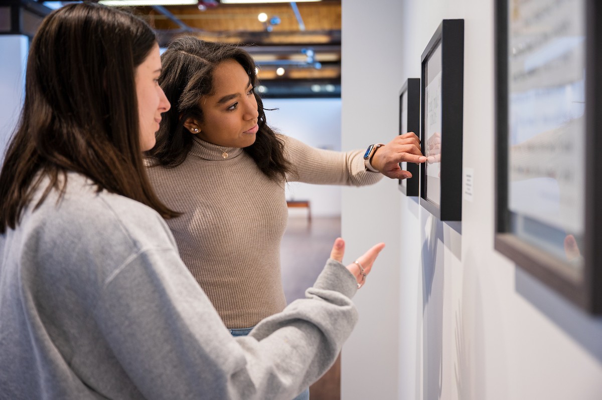 Two students look at an exhibit in the Villanova Art Gallery